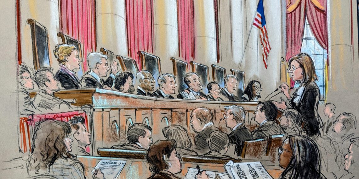 Sketch of the courtroom as a woman argues before the podium. Audience and several reporters can be seen, in addition to the full podium. Justice Gorsuch raises his hand while Justice Alito holds up and gestures to some documents.
