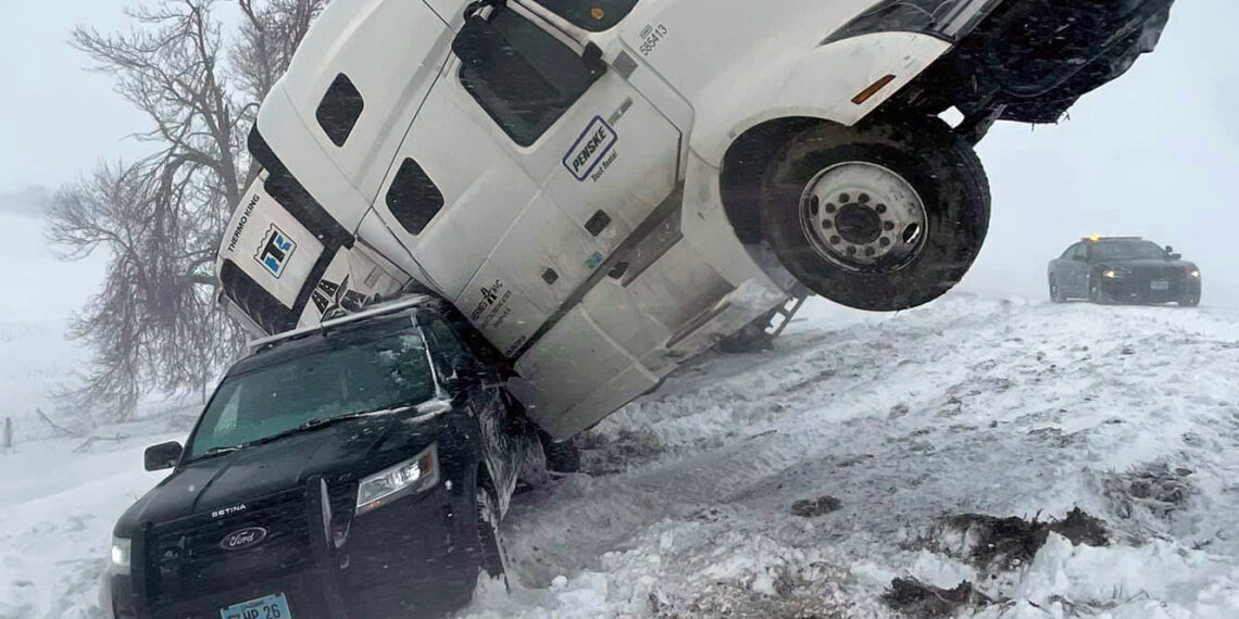 Semi-truck collides with South Dakota police cruiser during winter storm