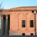 A side view of the Supreme Court building in pink sunlight.
