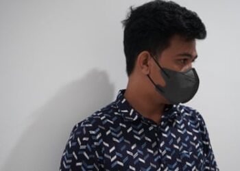 Rahim (a pseudonym) wearing a mask