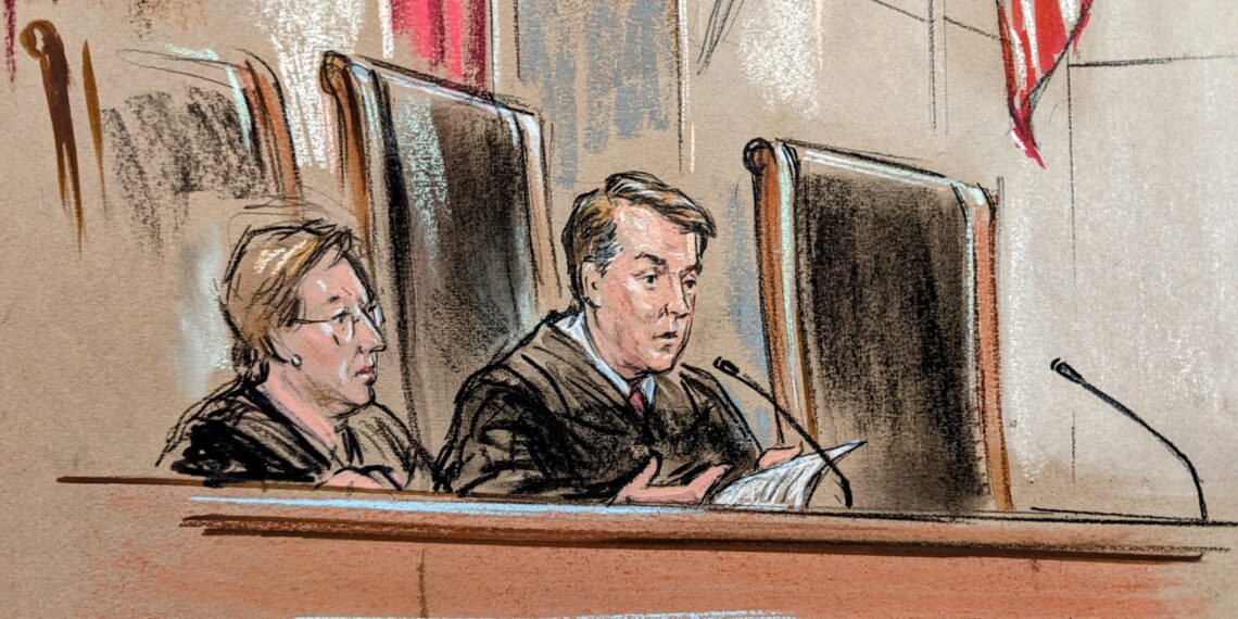 Man reading into microphone and woman listening next to him.