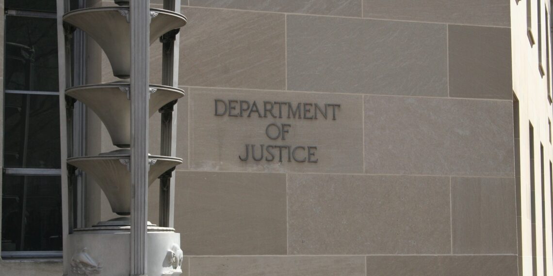 Department of Justice sign on a stone building