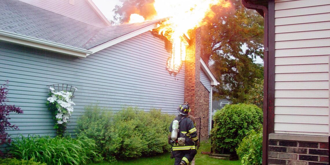 Firefighters help police corporal rescue his mother and artwork from house fire