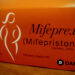 Orange box with "Mifeprex (mifepristone)" and a figure of a woman on it.
