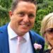 Jill Killington and Ian Pritchard in blue suit with pink flower