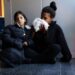 Venezuelan migrants Karen Malave and daughter Avril Brandelli, 7, eat food left by a volunteer on their seventh day of waiting inside Chicago's 16th District police station.