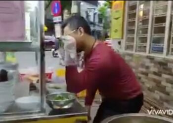 Screengrab of noodle seller Peter Lam Bui performing an impression of Salt Bae in a video he posted online
