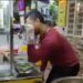 Screengrab of noodle seller Peter Lam Bui performing an impression of Salt Bae in a video he posted online