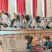 The justices on the bench with audience members listening in.