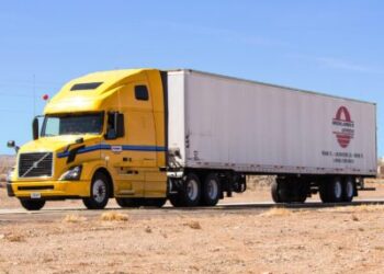 Big Rig with yellow car and white
