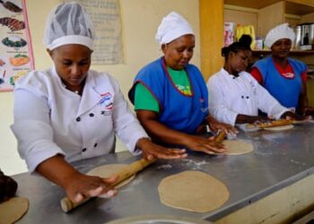 Women are taught how to make chapatis ahead of migrating to Saudi Arabia at The East African Institute of Homecare Management near Nairobi.