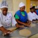 Women are taught how to make chapatis ahead of migrating to Saudi Arabia at The East African Institute of Homecare Management near Nairobi.