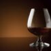 Glass of luxury cognac with copy space