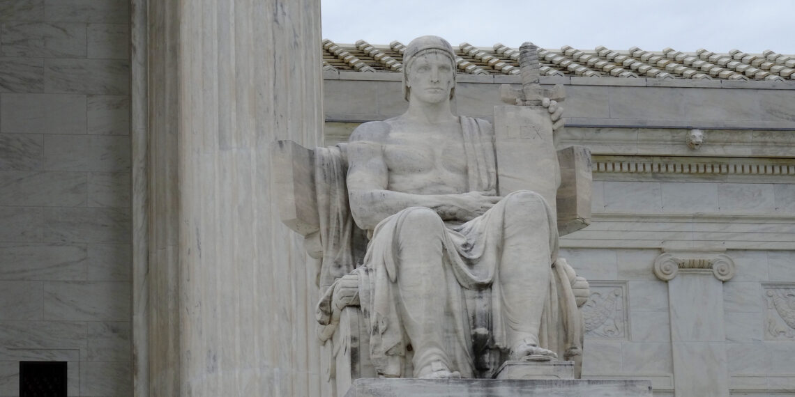 The statute of a seated man outside the Supreme Court