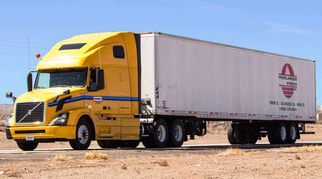 Big Rig with yellow car and white