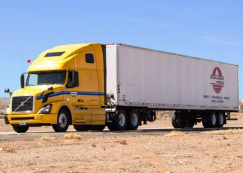 Big Rig with yellow car and white