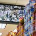 A monitor shows the video feeds of security cameras in a supermarket.