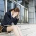 sad lawyer litigator in front of building