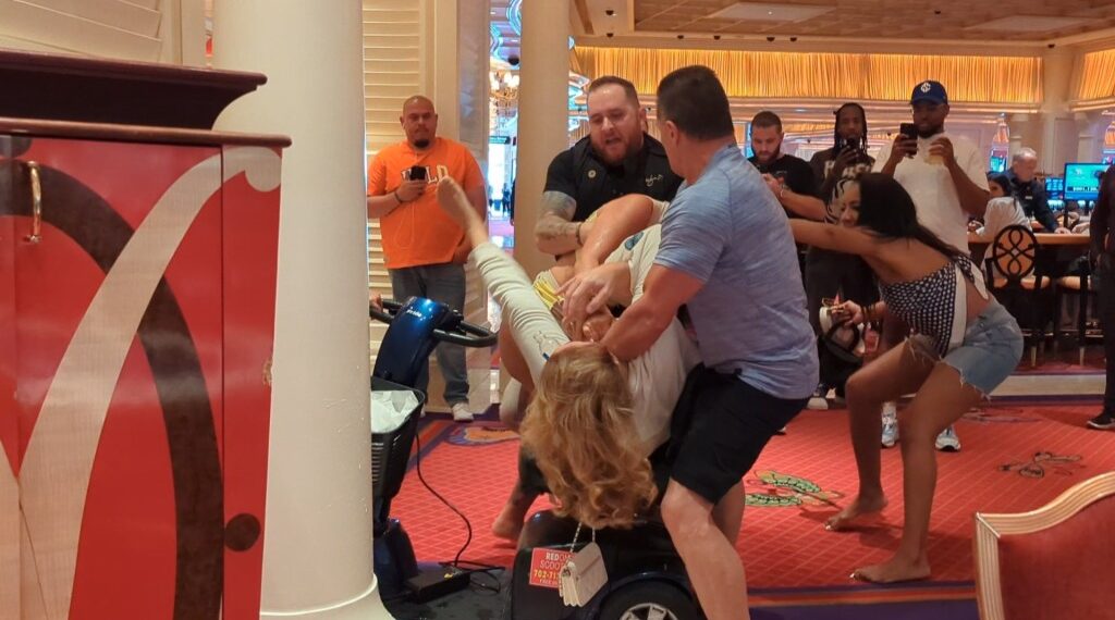 Part of the fight even included a women being dragged off a motorized scooter.