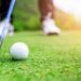 Close up golf ball on green grass