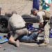 Two rangers were seen in video from the protest handcuffing a protesters' ankles together.