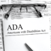 ADA paperwork with a pair of glasses on top of it
