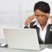 black lawyer with headache