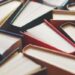 Many hardbound books background, selective focus