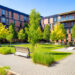 Panoramic view of an idyllic Montreal apartment complex with a landscaped courtyard in late Springtime on a clear sunny day.