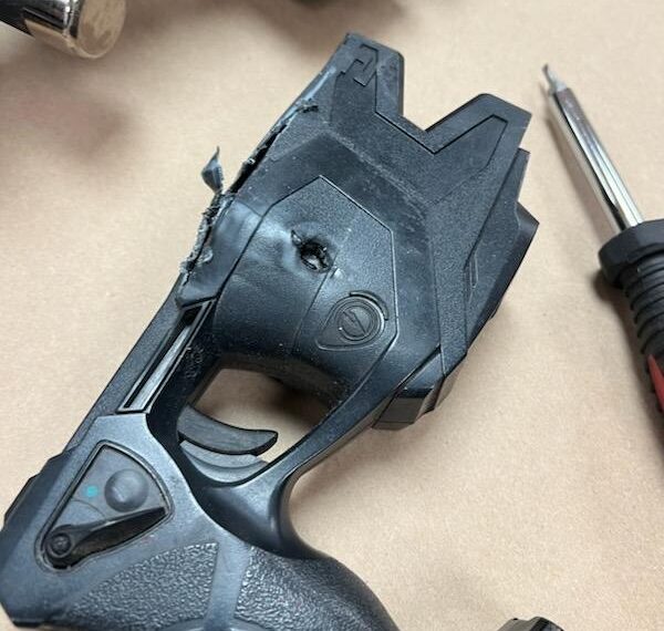 Bullet from suspect’s gun stopped by officer's holstered TASER during shootout