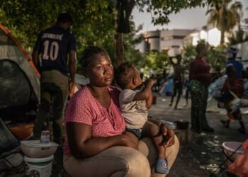 Salma, a 28-year-old Nigerian woman, with her son