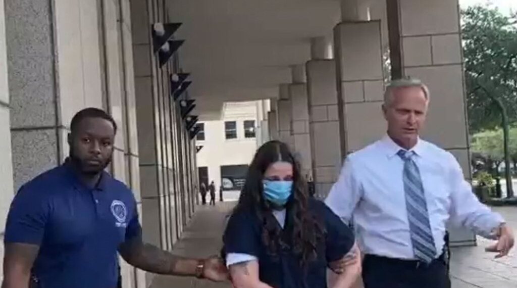 Bridgette Matthew is escorted to Metro Jail.