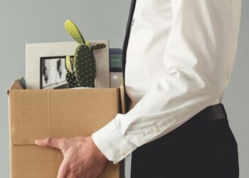 fired man in suit with boxes