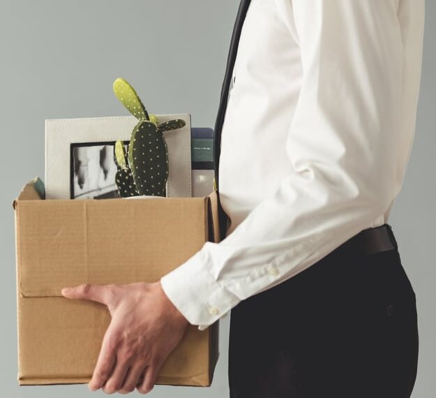 fired man in suit with boxes