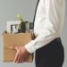 fired man in suit with boxes