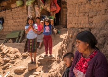 Patrocinia Mejía, 63, at her home with her family