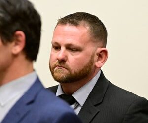 Aurora Police officer Randy Roedema, right, attends an arraignment at the Adams County Justice Center in Brighton, Colo., Friday, Jan. 20, 2023.