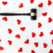 Gavel surrounded by red hearts, isolated on white, concept of legal action for divorce.