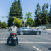 Motorcycle rider on at a stoplight.