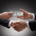 bribe handshake money