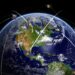 Satellites over world globe monitoring GPS localization