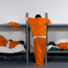 Two inmates sleep and one stands wearing prison uniforms. Some inmates will spend most of their time simply waiting, as not all prisons provide adequate opportunities for engagement in normal day-to-day activities.