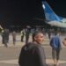 A from video footage shows protesters with a Palestinian flag invading the runway of Makhachkala airport