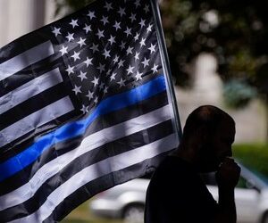 Prohibiting the use of the thin blue line flag restricts the free speech of public employees under the First Amendment, U.S. District Judge Karen Marston decided.
