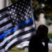 Prohibiting the use of the thin blue line flag restricts the free speech of public employees under the First Amendment, U.S. District Judge Karen Marston decided.