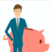 BUsinessman holding a Piggy bank Money rich