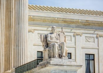 A statute on the steps on the Supreme Court