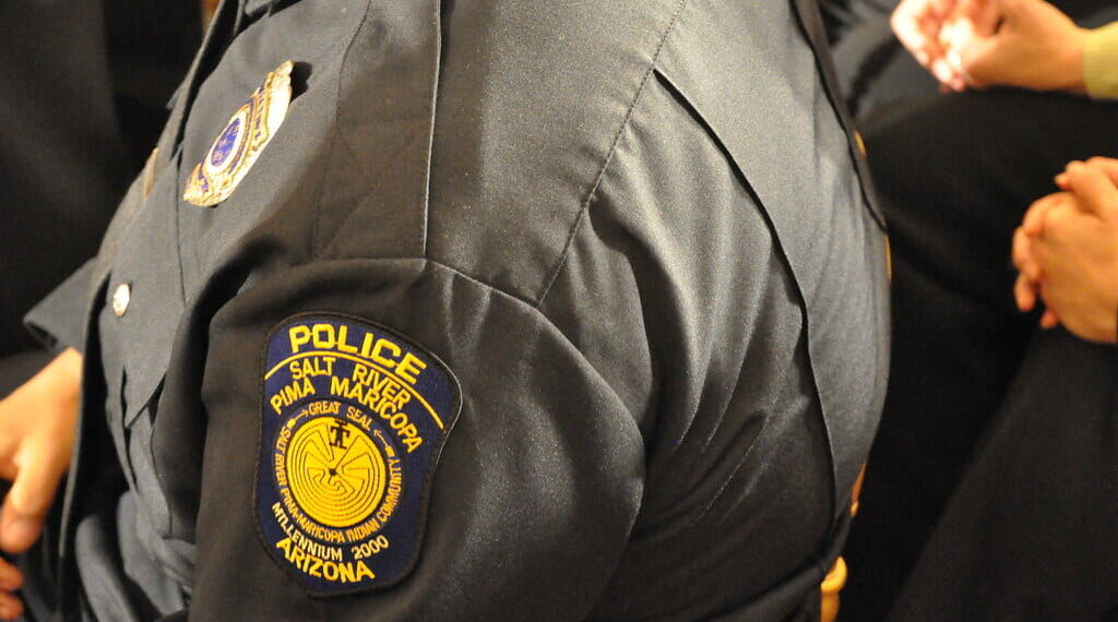 Tribal police officers have alternative uniforms and badges sometimes with details representing the Indigenous culture of their community.