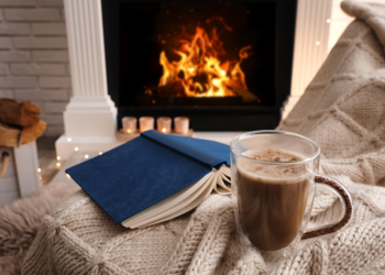 Cozy chair and cup of cocoa in front of a fire