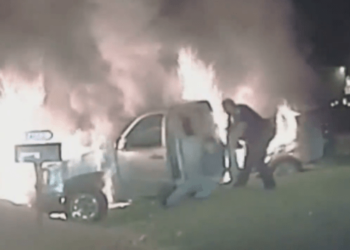 Michigan police release harrowing video showing officer rescue woman from burning truck – Law Officer